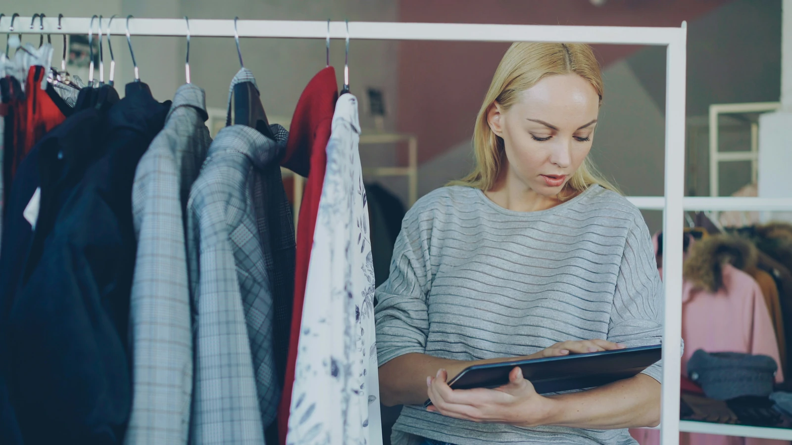 Retailer working with a tablet in her store.